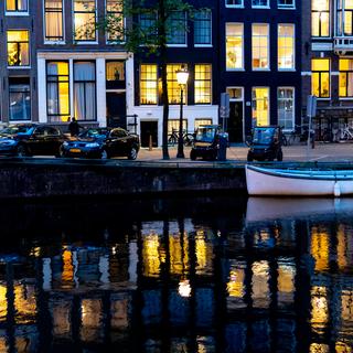 Van Gogh-esque photo of a Canal in Amsterdam at twilight.
