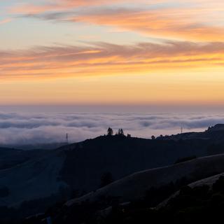 The marine layer rolls into the Santa Cruz mountains.