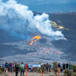 A crowd gathers to watch a rather underwhelming eruption.