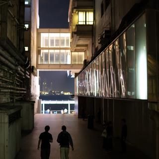 A seedy Hong Kong crime thriller, complete with sketchy characters sitting in the shadows.