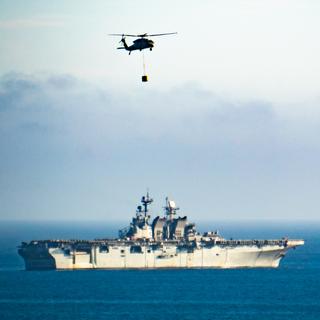 USS America (LHA-6) performing airlift exercises off the coast between San Diego and LA, taken while stuck in traffic.
